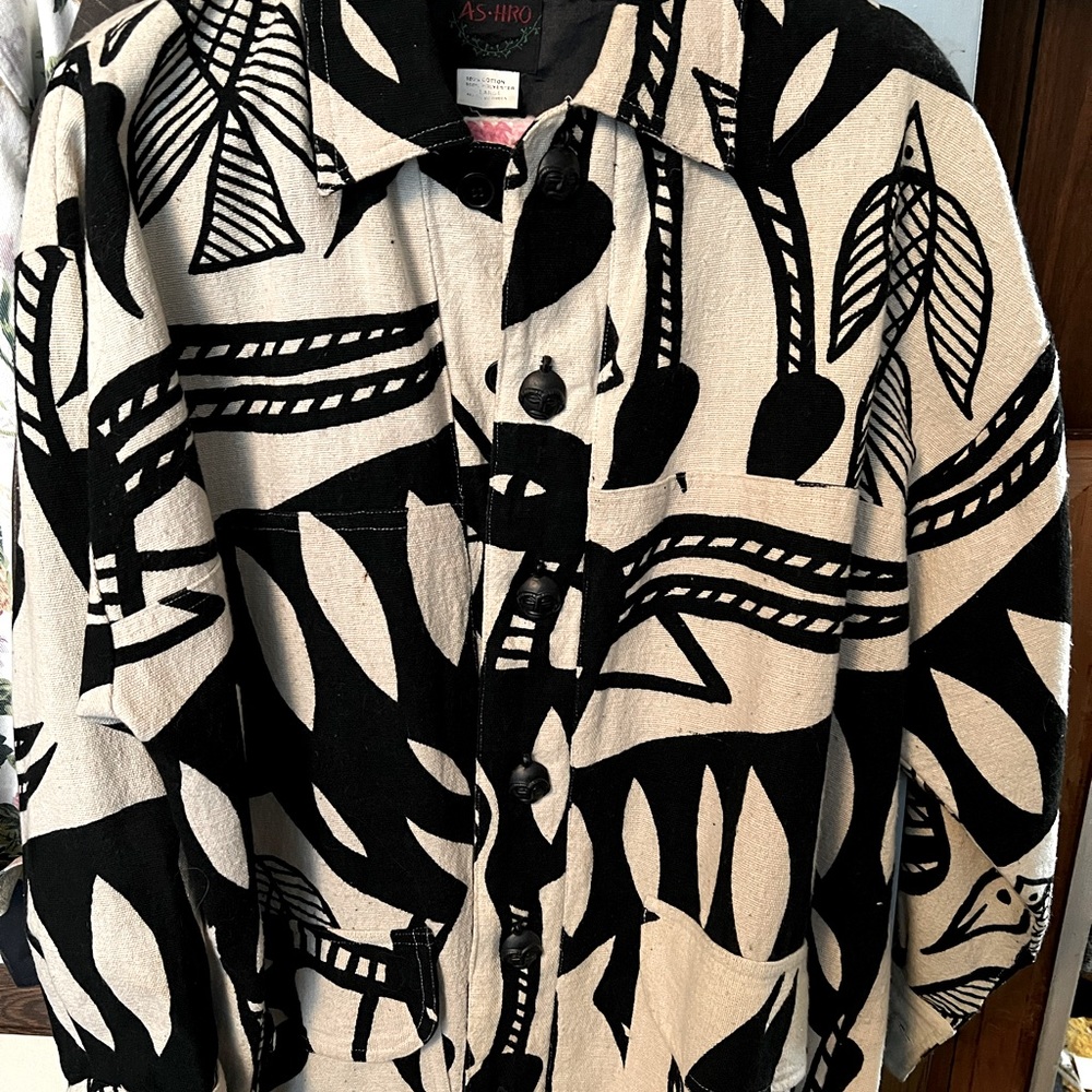 Woman's knit blazer, size L with unique designs